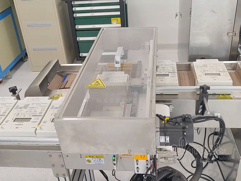 Stromzähler kollationieren - Kartoniermaschine